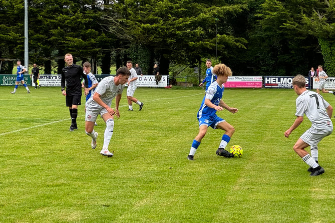 Crediton in possession during the match v Exeter City FC Academy side.  AQ 8003