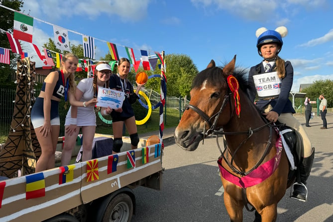 Year 8 Girls with their certificate for their float which had an Olympics theme.  AQ 8687