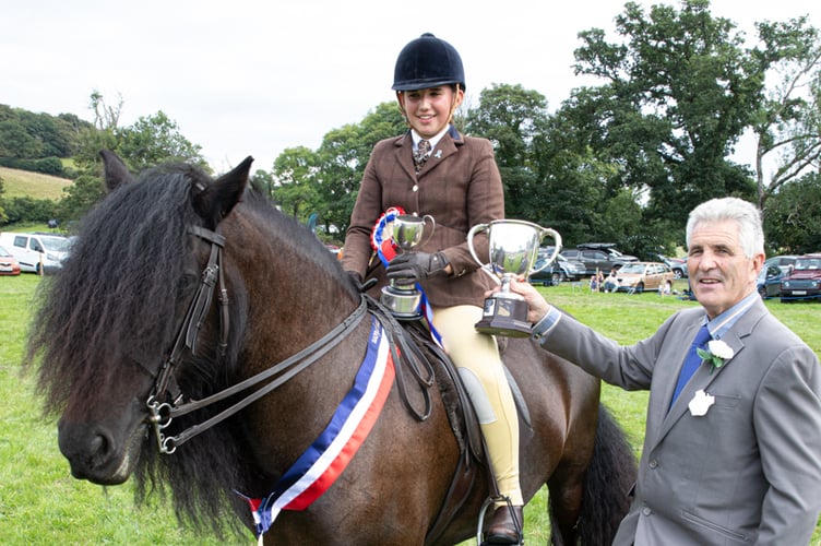 Prizes for a young winner at a previous Chagford Show.
