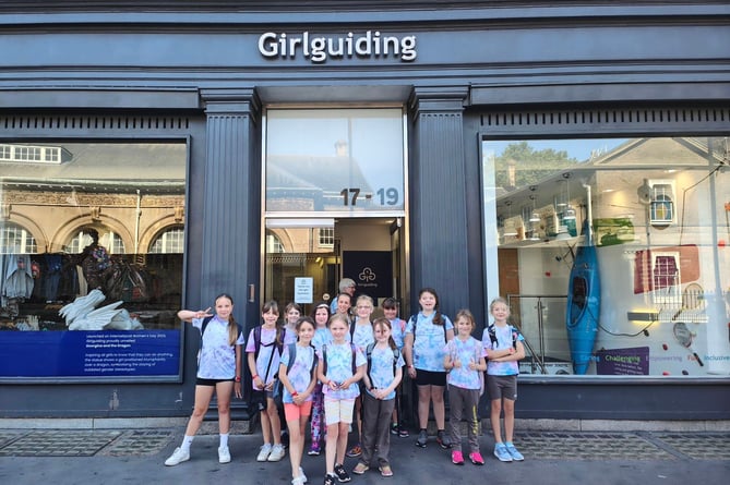 Outside the Girlguiding London Activity Centre ICANDO are the 4th Crediton Brownies.