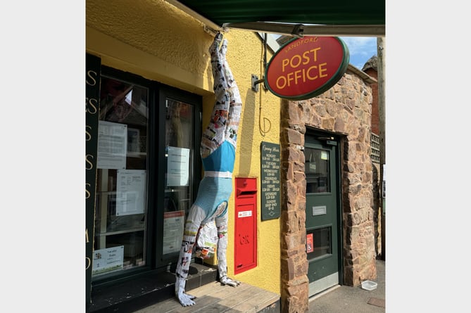 Sandford Community Stores with its Olympic scarecrow outside.  AQ 8837
