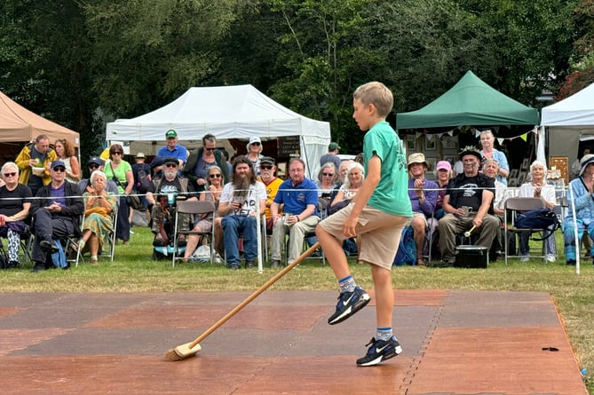 A Dartmoor Broom dancer in action at the Dartmoor Folk Festival.
