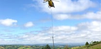 Helicopter replaces electricity poles near Tedburn St Mary