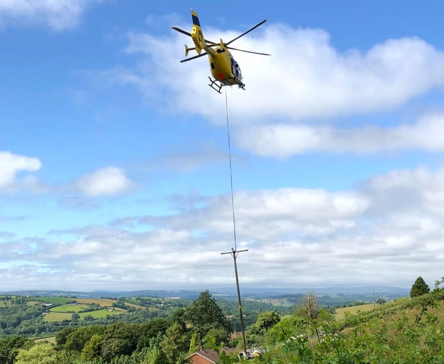 Helicopter replaces electricity poles near Tedburn St Mary