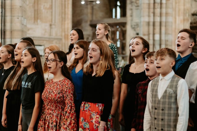 Centre Stage singers performing at the ABF Concert at Exeter Cathedral in 2023.
