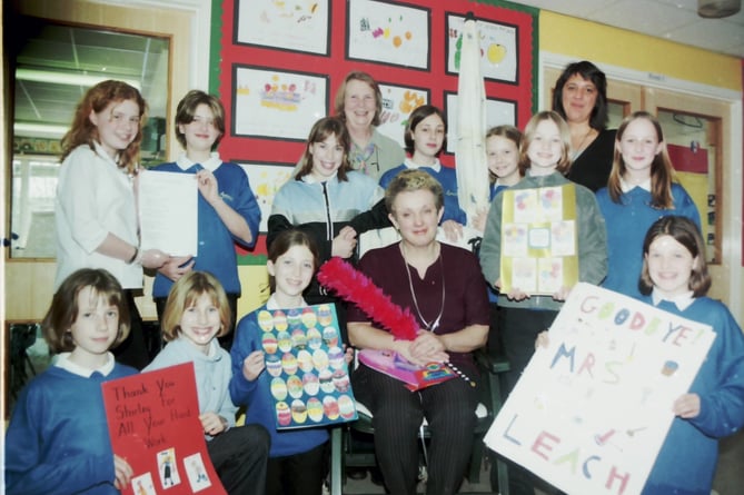 Landscore School pupils gave farewell gifts to Shirley Leach who was leaving after 13 years as caretaker in March 2002. DSC00205