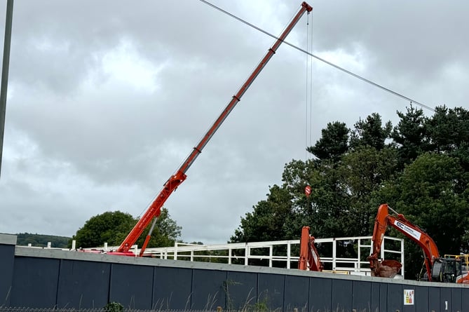 The Crediton Lidl store building structure and cranes and diggers on the site.  AQ 1290
