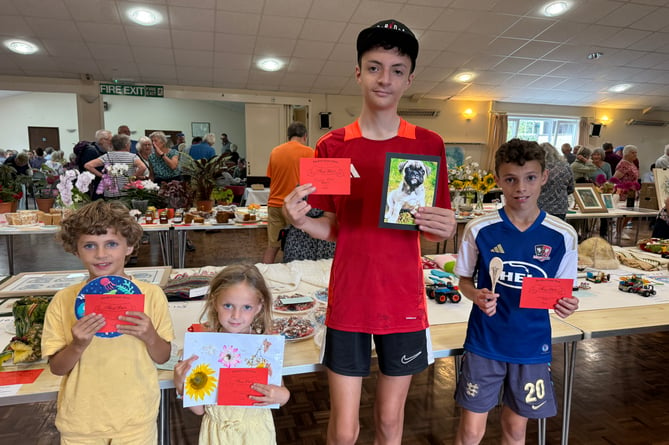 Young members of the Evens family who each received a first prize, from left, Arlo (7), Hallie-Rose (5), Marley (13) and Cassius (11).  AQ 1520
