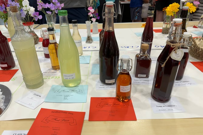 Bottles of homemade drinks were judged.  AQ 1530
