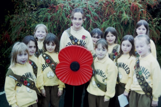 Members of the 3rd Crediton Brownies with their poppy at the Crediton Remembrance parade in November 2002. DSC00063