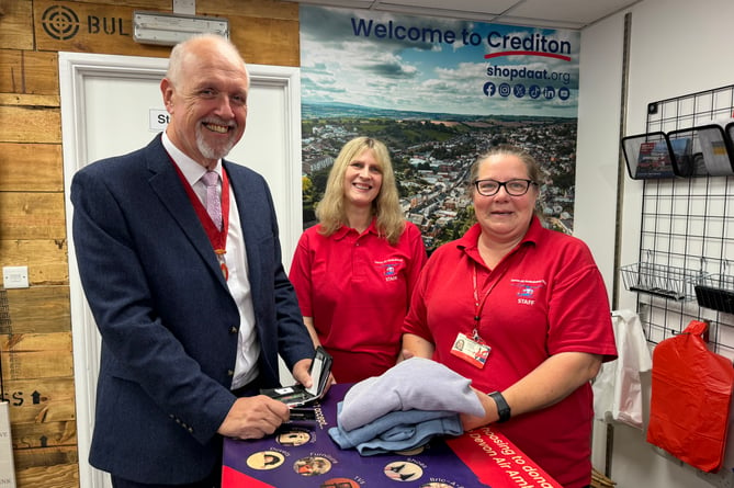 Deputy Mayor of Crediton, Cllr Steve Huxtable, was the first customer at the Crediton Devon Air Ambulance charity shop.  AQ 2168
