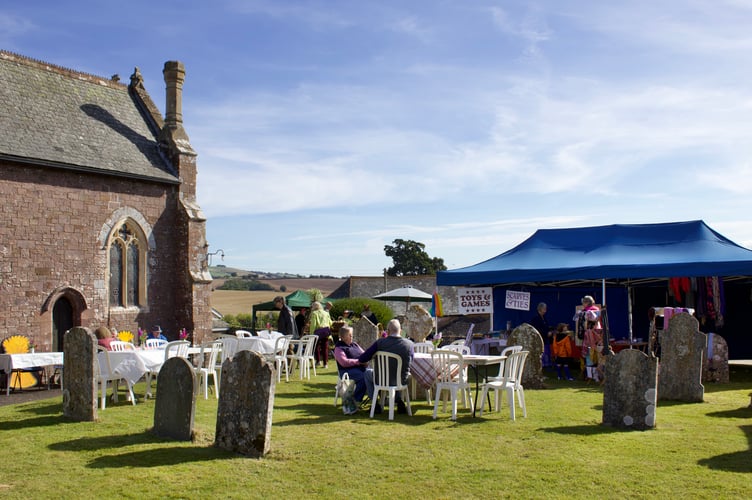 Outside St Swithun's Church during harvest event