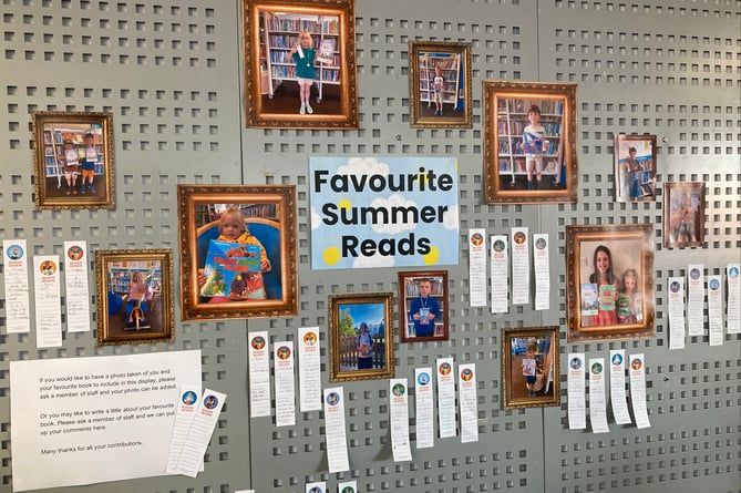 The exhibition at Crediton Library features youngsters holding their favourite books and written reviews