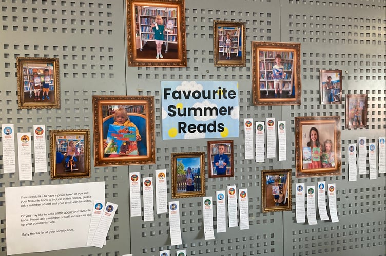 The exhibition at Crediton Library features youngsters holding their favourite books and written reviews