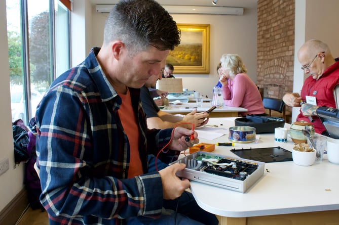 Rob Byrnes tackling a defective DVD player