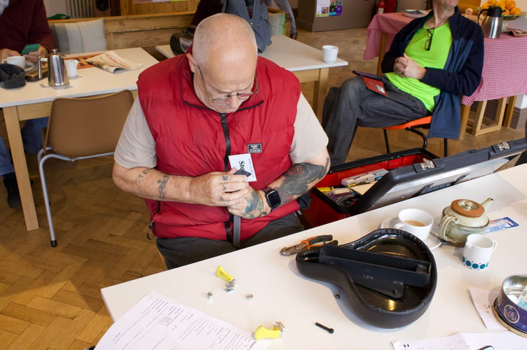 Steve Jones putting together a bicycle seat