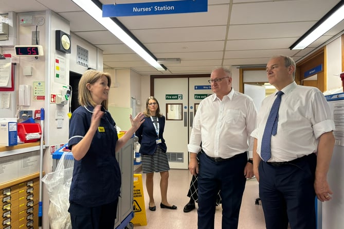 MPs Sir Ed Davey and Ian Roome talk with staff in the Intensive Care Unit at NDDH