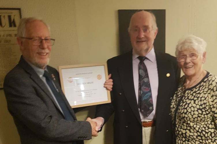 Reuben Miles, centre, pictured with his wife, Heather, receiving a certificate commemorating his long service in Rotary from Crediton Boniface Rotary President Fred Oliver.
