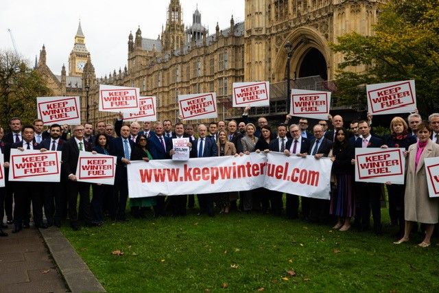 Mel Stride, MP for Central Devon and Shadow Secretary of State for Work and Pensions, outside Parliament alongside fellow Conservative MPs preparing to present the ‘Keep Winter Fuel petition’ to the Treasury. 
