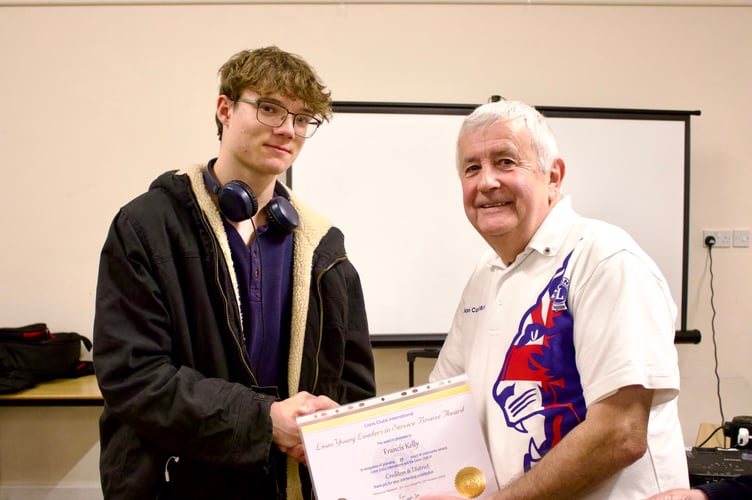 Francis Kelly receiving his Lions Young Leaders in Service Bronze Award from Lion Colin Marsh