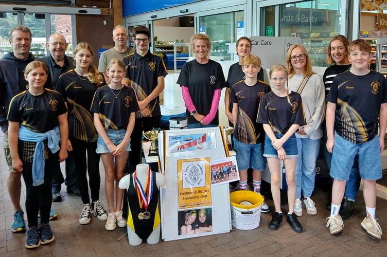 Members of Crediton and District Swimming Club who took part in bag packing at Crediton Tesco store. 
