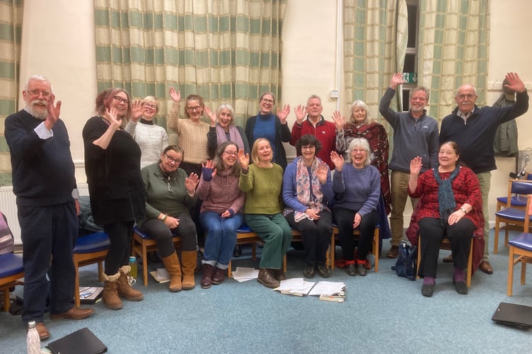 Musical director Roland Smith, left, and composer Alison Willis, second left, with members of The Winkleigh Singers at a rehearsal.
