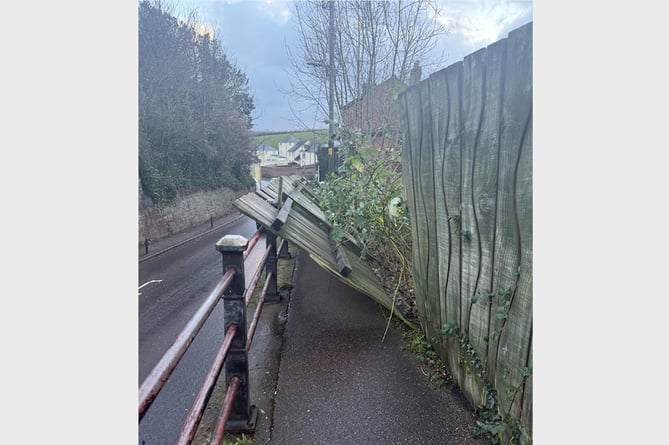 The fallen fence across the footpath in Exeter Road, Crediton.
