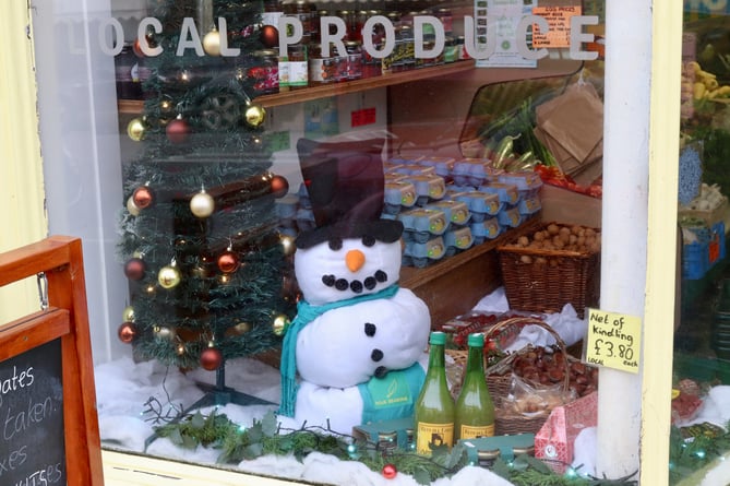 A snowman in Four Seasons' window