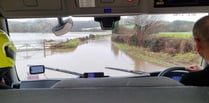 Dramatic boat rescue for couple from vehicle in floodwater