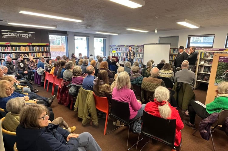 Crowd enjoying wassail concert at Crediton Library