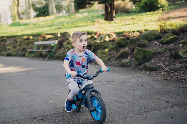 A child with a toy donated through the Tesco pre-Christmas toy appeal.
