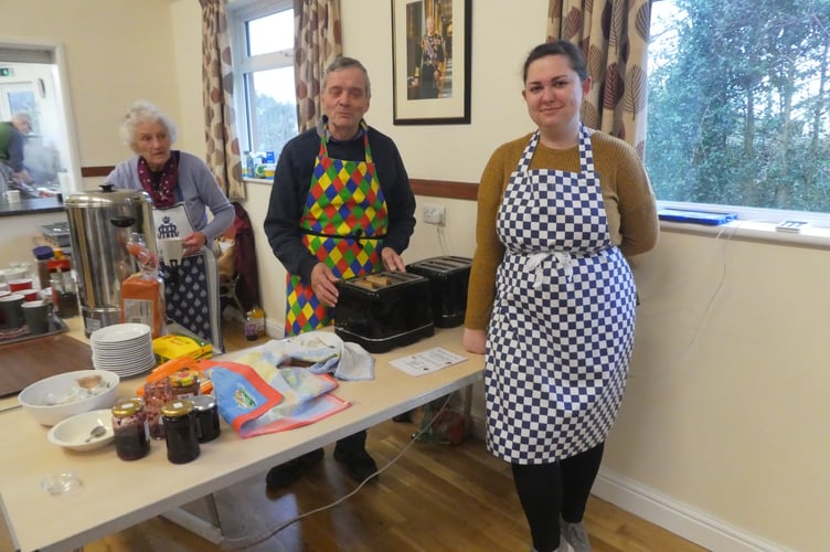 Brenda Fowler, Roy Clayton and Holly Kingdon serving breakfasts in the parish hall