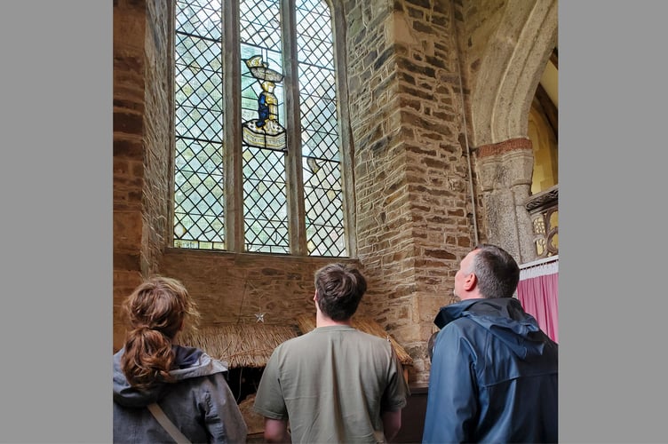 Looking at the stained glass image of Edward V in Coldridge Parish Church window.
