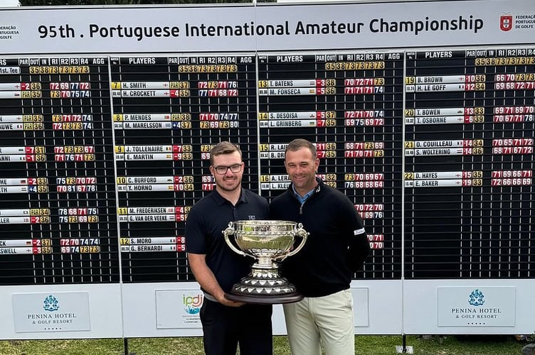 Eliot Baker, left, with trophy