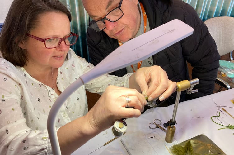 Learning how to make a fly at a previous South West Fly Fair.
